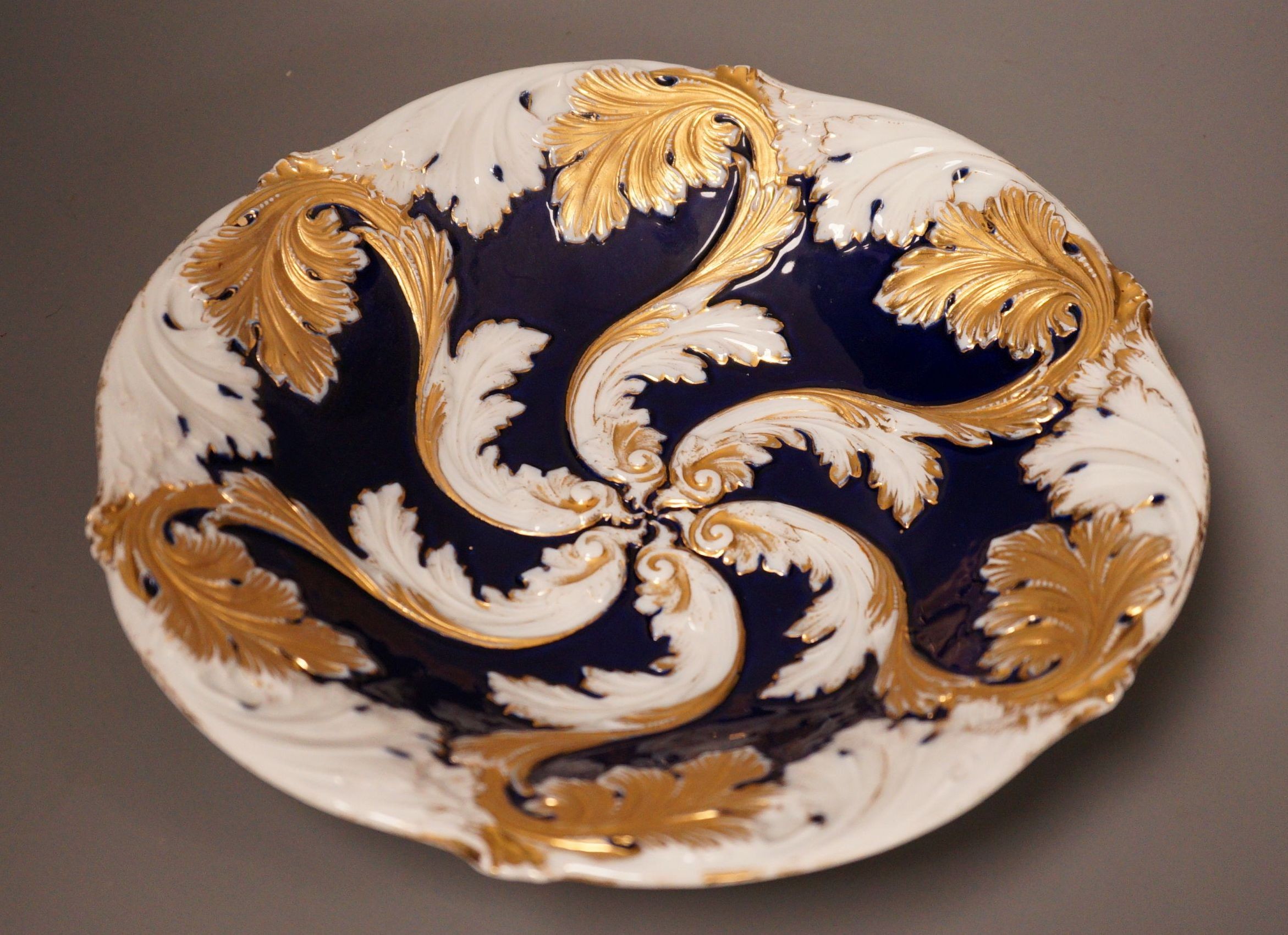 A late 19th century Meissen acanthus motif bowl, with gilt decoration, 28cm